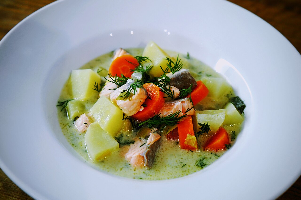 A bowl of lohikeitto, Finnish salmon soup, with potatoes and dill