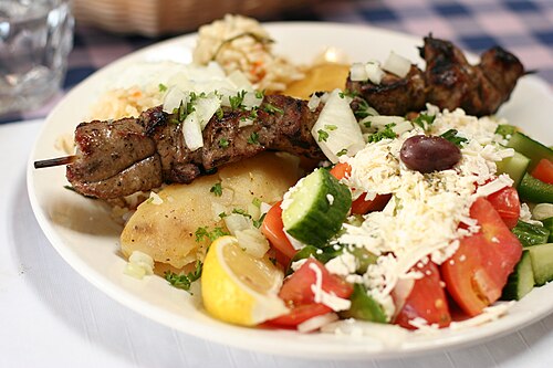 Grilled lamb souvlaki skewers served on a plate