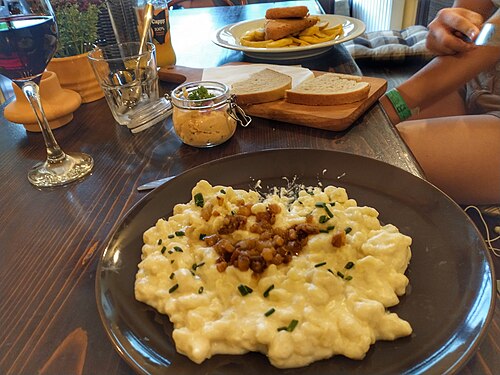 A plate of bryndzové halušky, small potato dumplings in sheep cheese sauce, in Bratislava