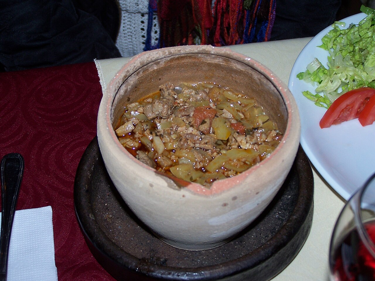 A testi kebab, the clay pot kebab of Göreme, served at a table