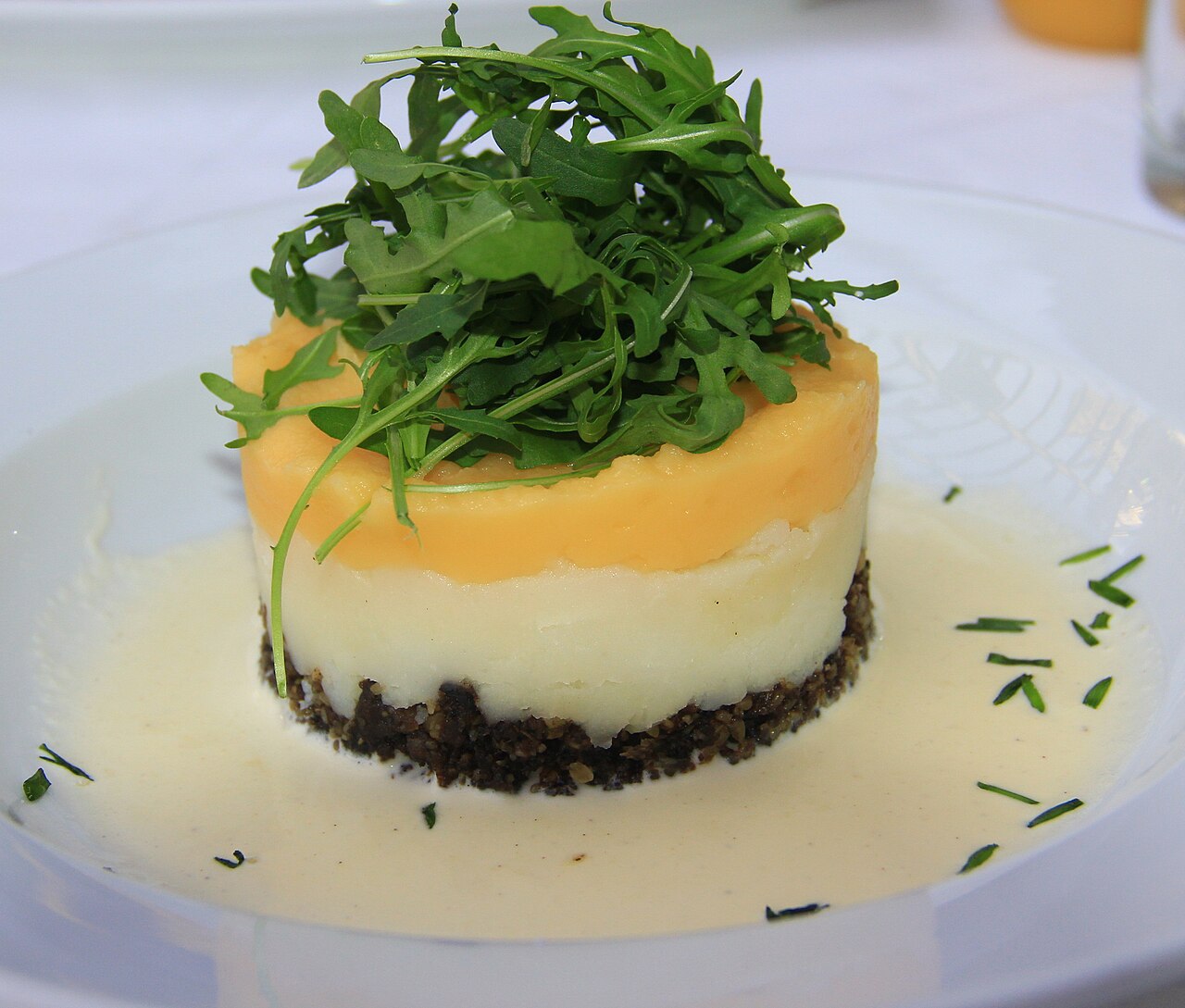A plate of haggis with mashed turnip and potato