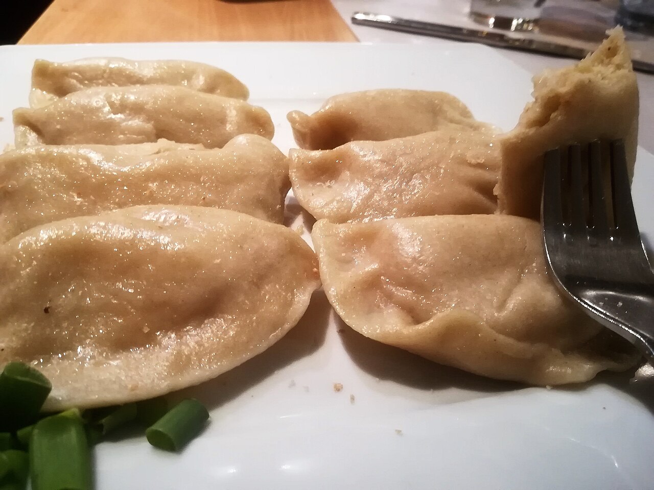A plate of pierogi ruskie, dumplings filled with potato and curd cheese, in Gdańsk