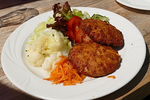 Kaspressknödel, fried cheese dumplings, served with a green salad