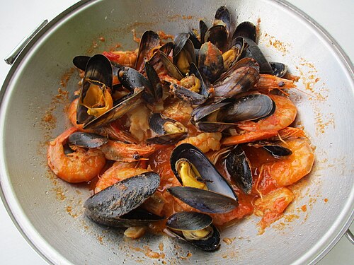 A cataplana, a seafood stew from the Algarve, served in its pan