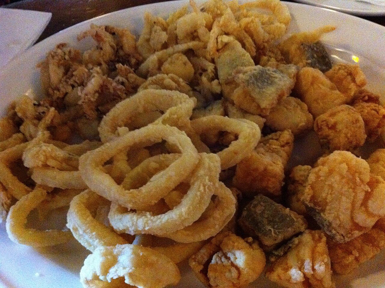 A plate of pescaíto frito, small fried fish, served in Málaga