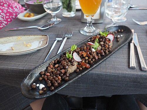 A plate of Latvian gray peas with bacon at Restaurant Milda in Riga