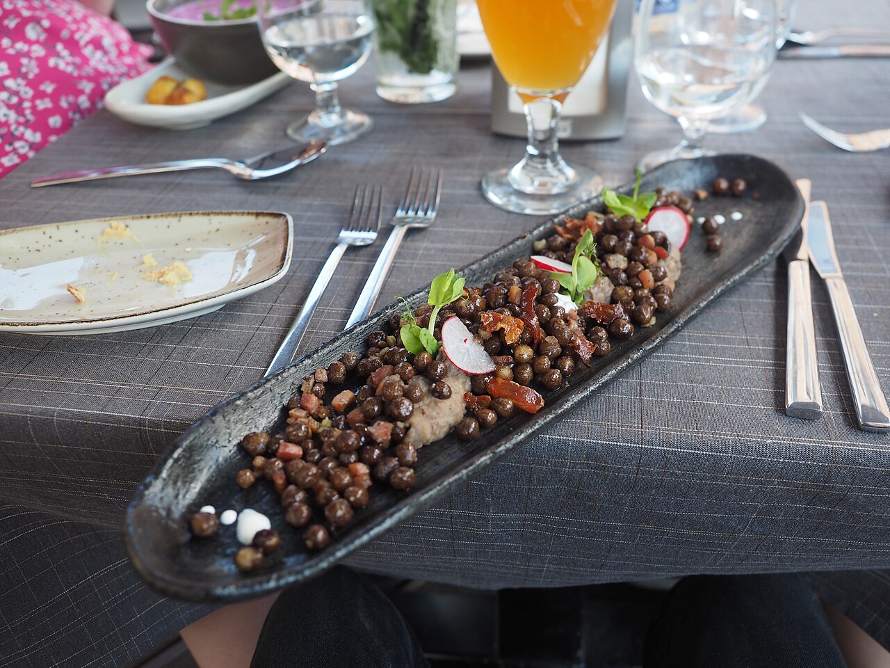 A plate of Latvian gray peas with bacon at Restaurant Milda in Riga